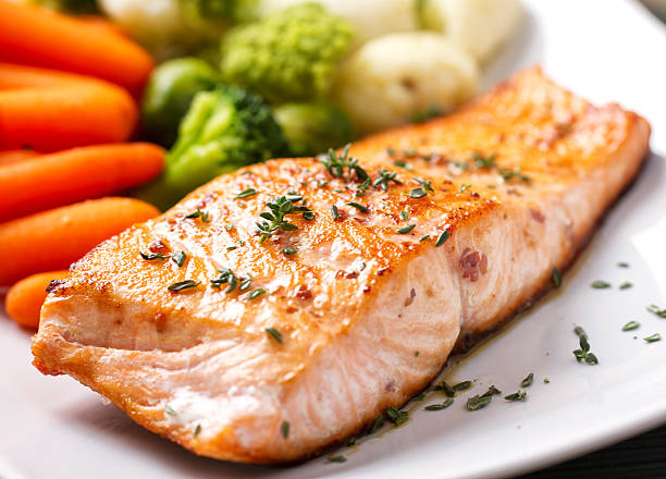 Fillet of salmon with mixed vegetables Fillet of salmon with mixed vegetables grilled salmon stock pictures, royalty-free photos & images