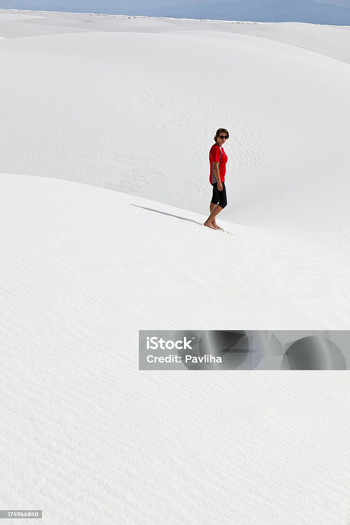 Young Woman on White Sand Ripples, New Mexico, USA "Teenager in sportswear (walking) standing in White Sands Nationa Monument, New Mexico, Southwest USA." Adult Stock Photo