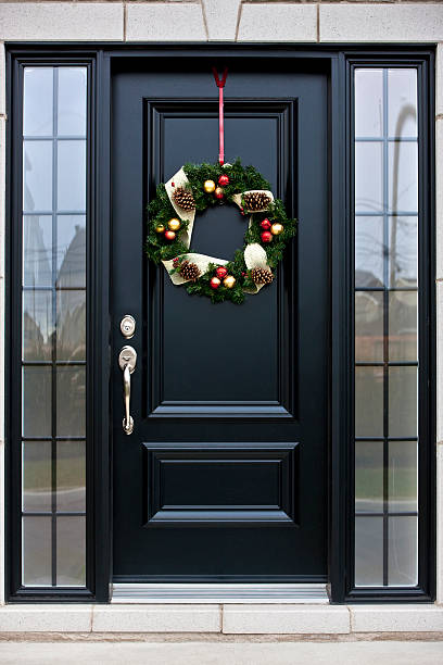 istock Christmas wreath on black door 174966959