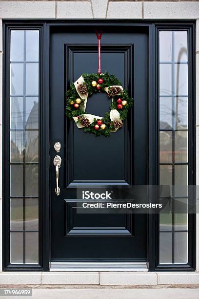 Christmas Wreath On Black Door Stock Photo - Download Image Now - Christmas, Door, Front Door