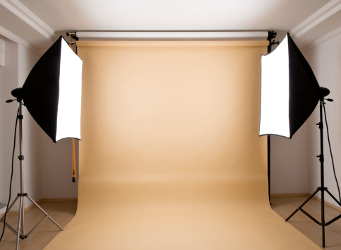 Empty photographic studio ready for shoot with brown background