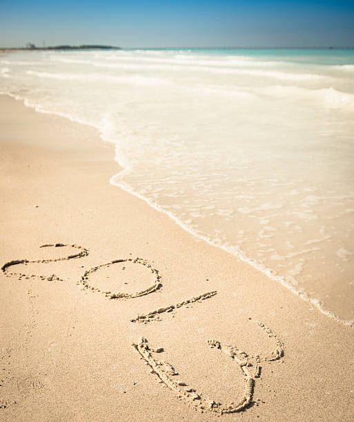 istock New Year's on the sand beach - 2013 174967425