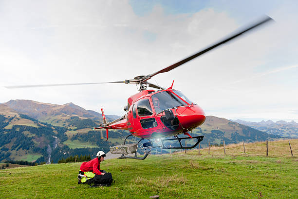 istock rescue helicopter taking off from mountain 174968011