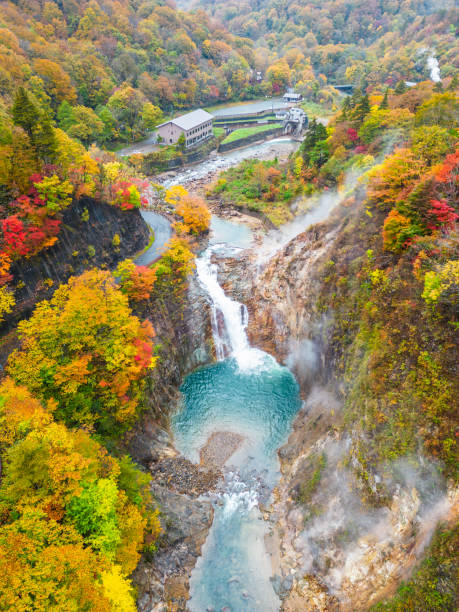 High in the mountains of Shizukuishi in North Japan with colorful autumn colors, hot spring steam pockets and a majestic waterfall.