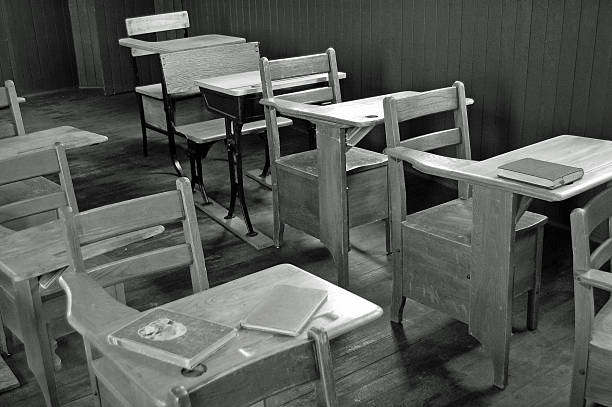 Vintage  Desks in Black and White Old classroom student desks in a rural one room schoolhouse... Black and White schoolhouse stock pictures, royalty-free photos & images