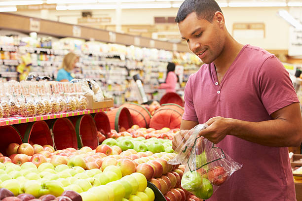 istock Man At Fruit Counter In Supermarket 174968267