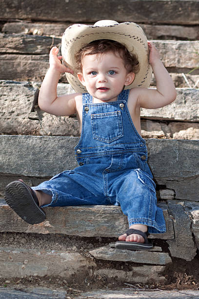 istock Little Boy Outdoors in Blue Denim Overalls 174968600
