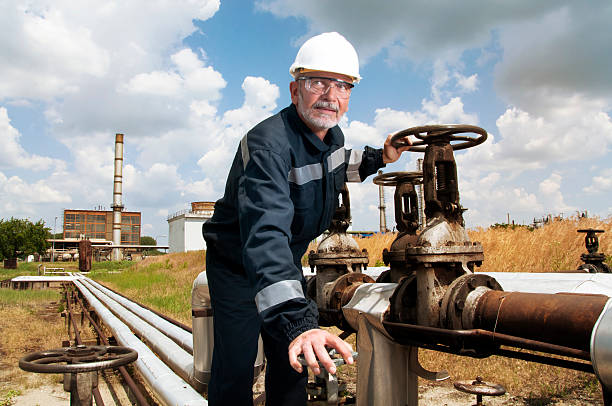 Engineer doing some work in oil refinery stock photo