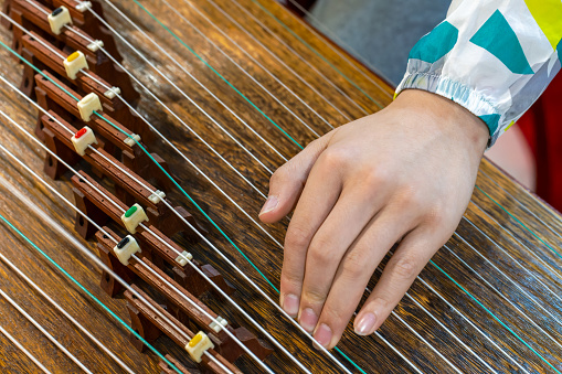 Play Chinese musical instrument - guzheng