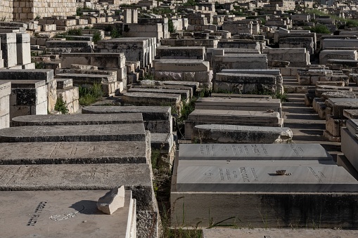 jerusalem, Israel – October 02, 2023: A large cemetery featuring a multitude of graves and a sky-filled background
