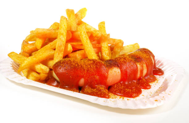 Germany, Berlin, Prenzlauer Berg, July 30, 2025 - Berlin currywurst with French fries