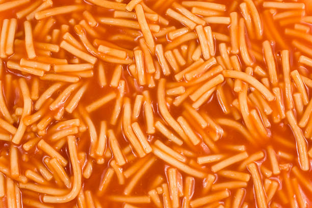 Spaghetti pieces in tomato sauce close-up