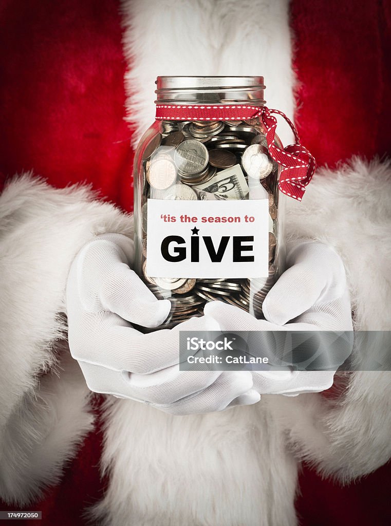 'Tis the Season to Give Santa with donation jar. Abundance Stock Photo