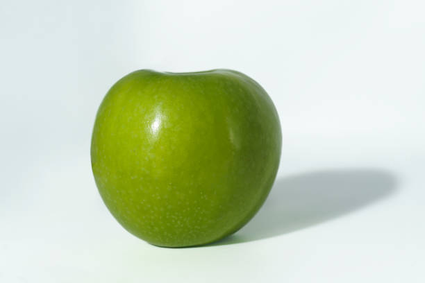istock green whole apple granny on a black background with shadow top view 1749723967