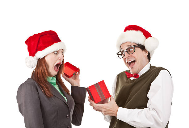 istock Frightened Woman Opeing Christmas Gift From Office Nerd 174972586