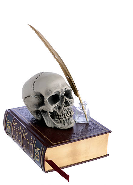 William Shakespeare Old Yale William Shakespeare complete works book with a skull and gold feather isolated on white background. william shakespeare photos stock pictures, royalty-free photos & images