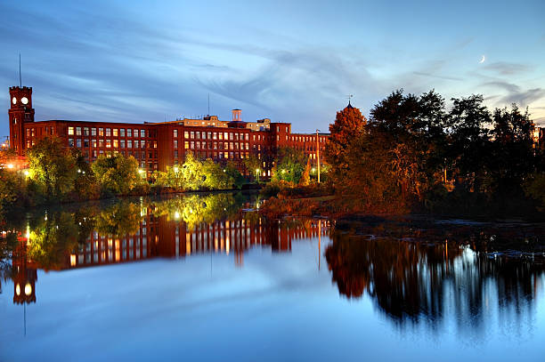 Nashua, New Hampshire Nashua New Hampshire mills reflection on the Merrimack River. Nashua is the second largest city in the state of New Hampshire. Nashua is known for its  livability and economic expansion as part of the Boston region nashua new hampshire stock pictures, royalty-free photos & images