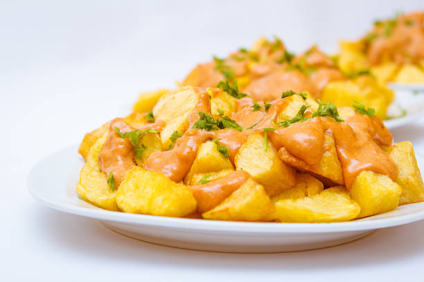 Patatas Bravas Fresh, studio isolated Patatas Bravas patatas bravas stock pictures, royalty-free photos & images