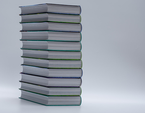 Stack of books isolated, hardcover collection on light background