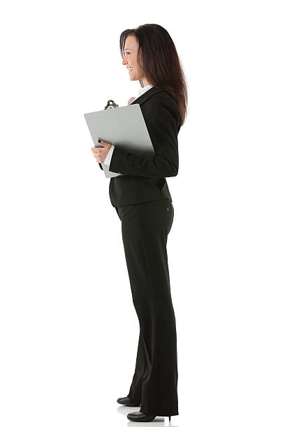 istock Businesswoman standing with a clipboard 174973650
