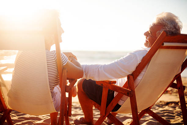 istock Senior couple relaxing on the beach 174973659