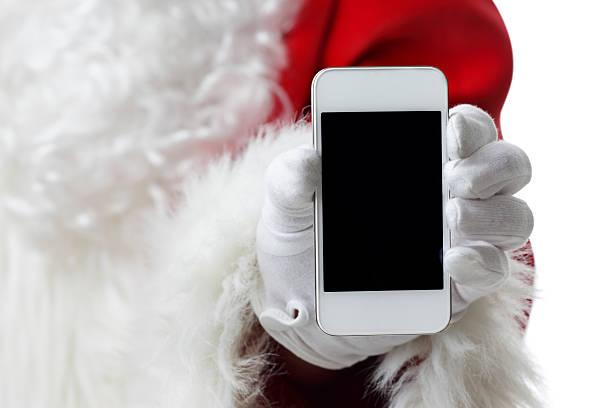 istock Santa showing a white smart phone 174974125