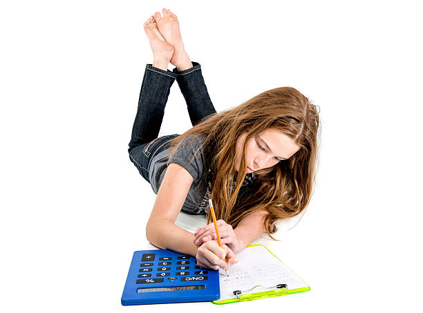 Child in school uniform with a backpack and book pointing at a blackboard with math formulas
