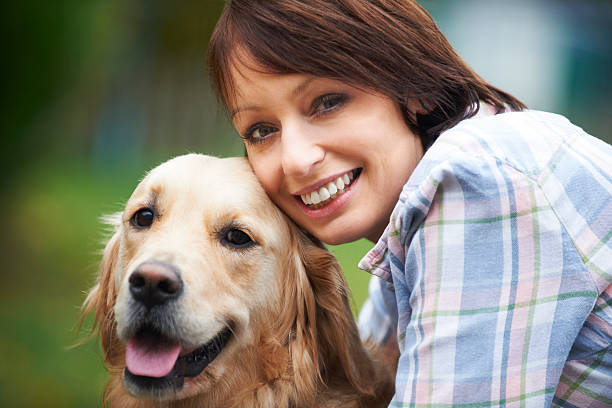 istock Woman With Pet Golden Retriever 174974569