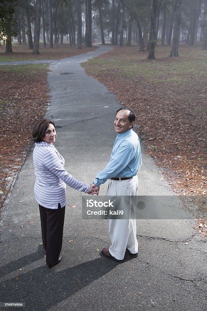 Hispanic couple walking in park - Стоковые фото Верхний ракурс роялти-фри