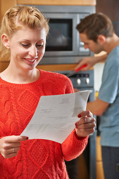 istock Happy Customer With Repair Bill 174975070