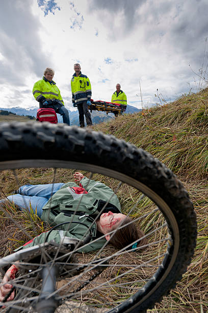 istock paramedics attending to injured mountain biker 174975370