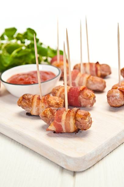 istock Sausages Wrapped In Bacon 174975485