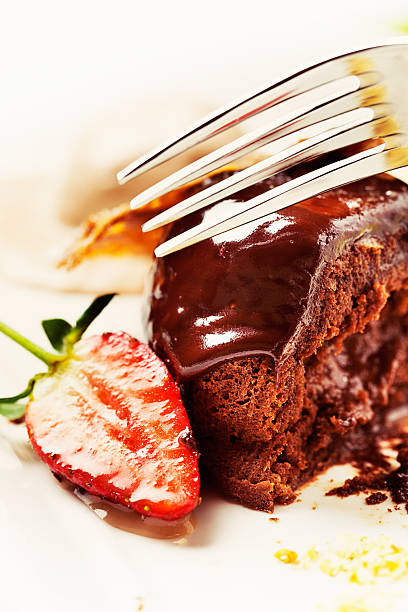 istock Fork slices into delicious-looking hot chocolate pudding oozing sauce 174975716