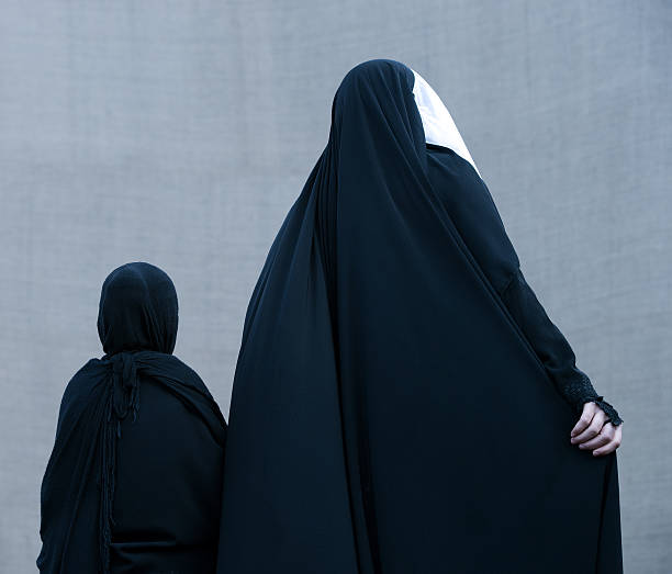 istock Muslim woman walking with her daugther 174976157