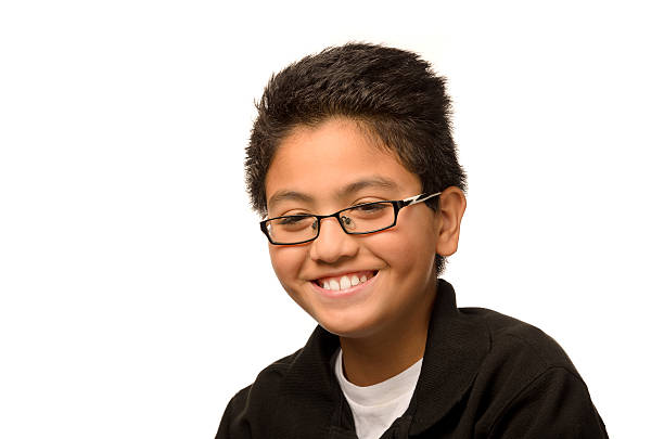 Young Boy Smiling with Glasses stock photo