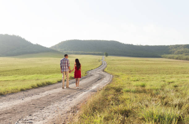 istock Back view of young couple in nature 174976317