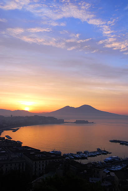 Sunrise over the Bay of Naples Early morning shot of the Bay of Naples with Mt. Vesuvius looming in the Background as the sunrises over Naples. extinct volcano stock pictures, royalty-free photos & images