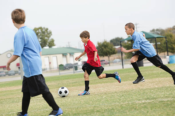 istock Youth league soccer teams playing game 174977077