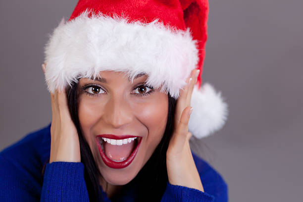 Beautiful woman wearing the Santa Hat