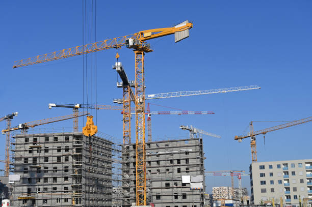 istock Construction site with cranes machinery and buildings 1749773636