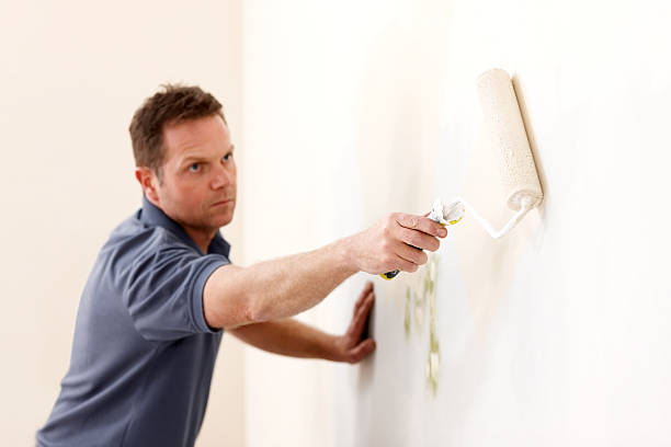 istock Man renewing home paint 174978386