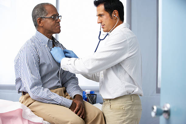 istock Doctor using a stethoscope on a patient listening to heart 174978531