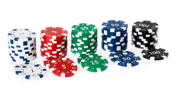 Casino chip stacks over white background