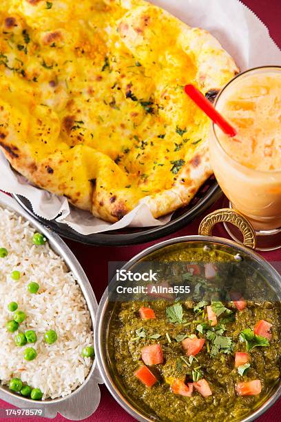 Indian Food Saag Paneer With Basmati Rice Naan And Drink Stock Photo - Download Image Now