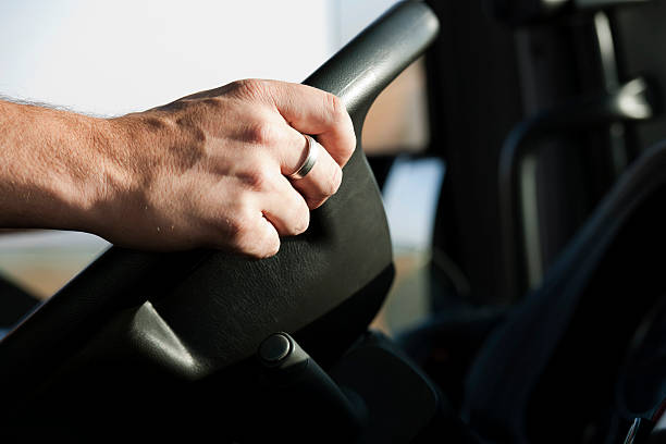 Hands on steering wheel stock photo