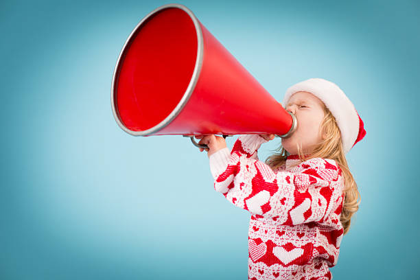 istock Santa's Little Helper Making Announcement With Megaphone 174978805