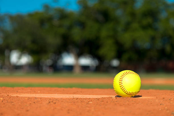 Softball on Baseball Diamond Softball on Baseball Diamond softball ball stock pictures, royalty-free photos & images