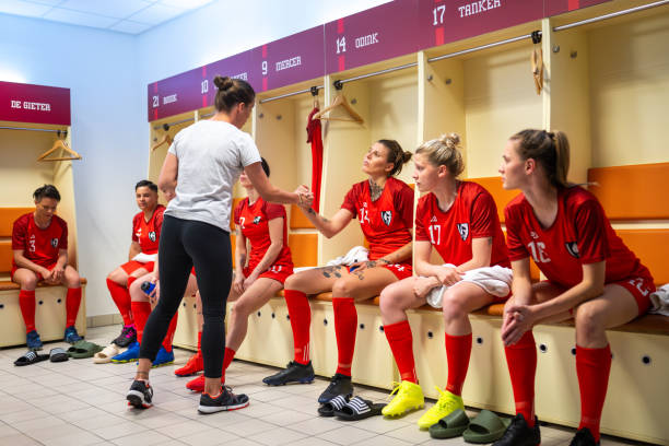 istock Soccer trainer and female players shaking hands 1749790211