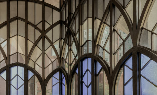 istock Antique multicolored stained glass window panel are decorated in monastery chapel. 1749791078