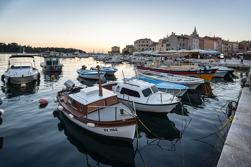 Rovinj, Croatia - October 7, 2023: Small boats in the crowded harbor in Rovinj at sunset